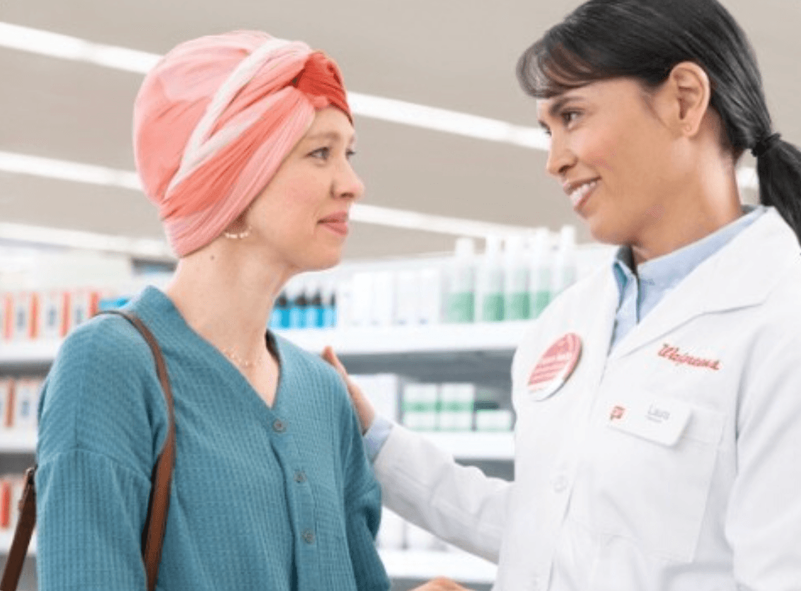 Walgreens pharmacist and person wearing head wrap